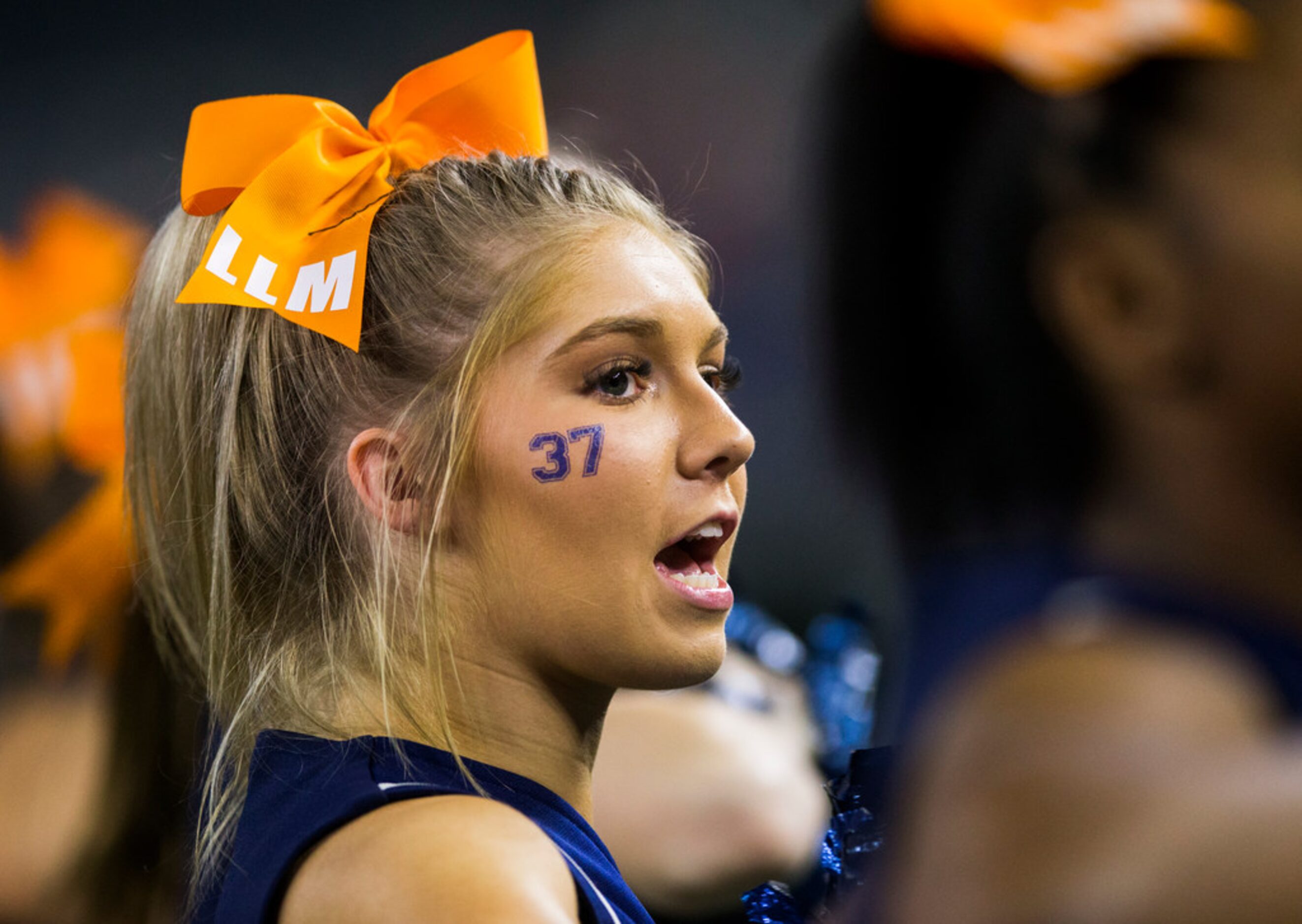 Allen cheerleaders wear the number 37 on their cheeks to honor Marquel Ellis Jr., a...