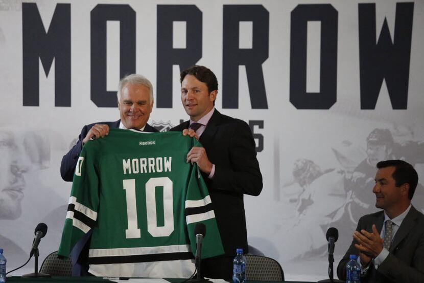 Dallas Stars Jim Lites, left, team president poses with Brenden Morrow with a #10 jersey as...