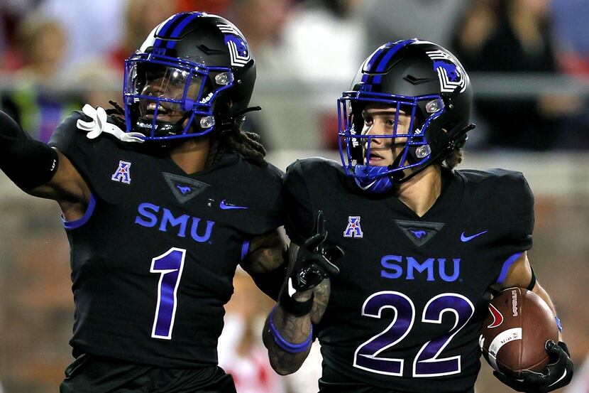 SMU safety Brandon Crossley (1) and safety Nick Roberts (22) celebrate after Roberts...