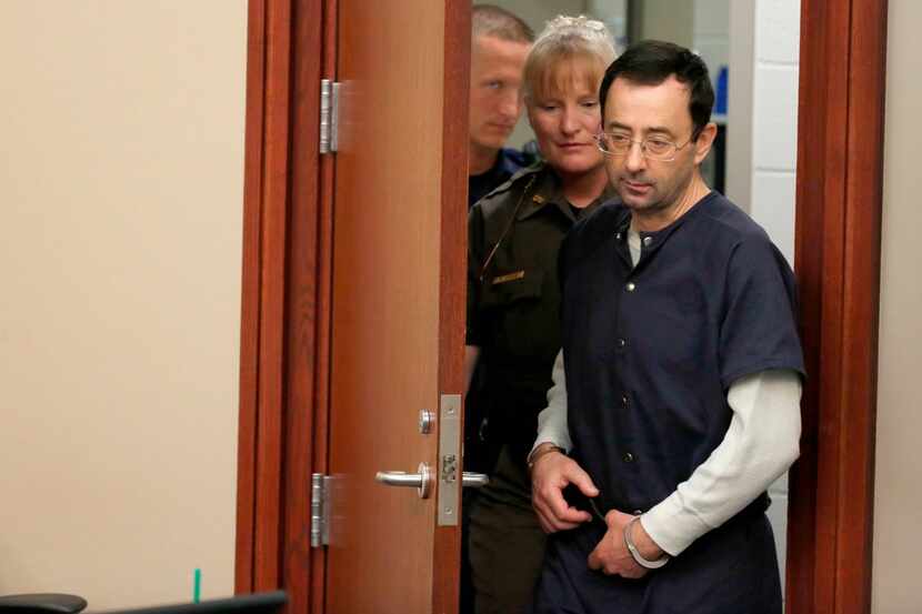 Former Michigan State University and USA Gymnastics doctor Larry Nassar arrives for impact...
