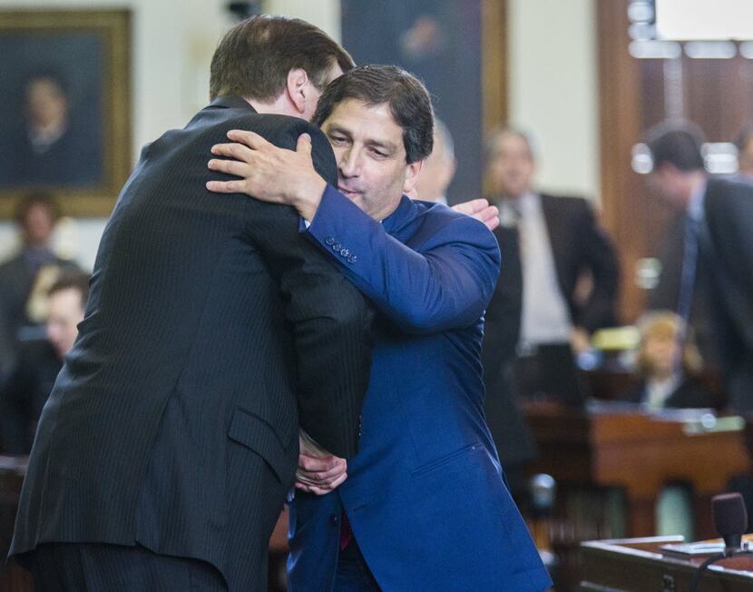 Sen. Kevin Eltife, R-Tyler (right), hugs Lt. Gov. Dan Patrick during the 2015 legislative...