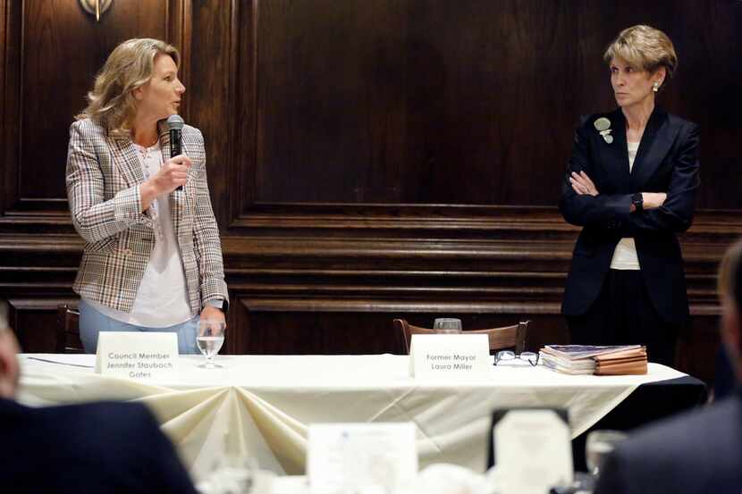 Former Dallas Mayor Laura Miller (right) listens to  Dallas City Council member Jennifer...