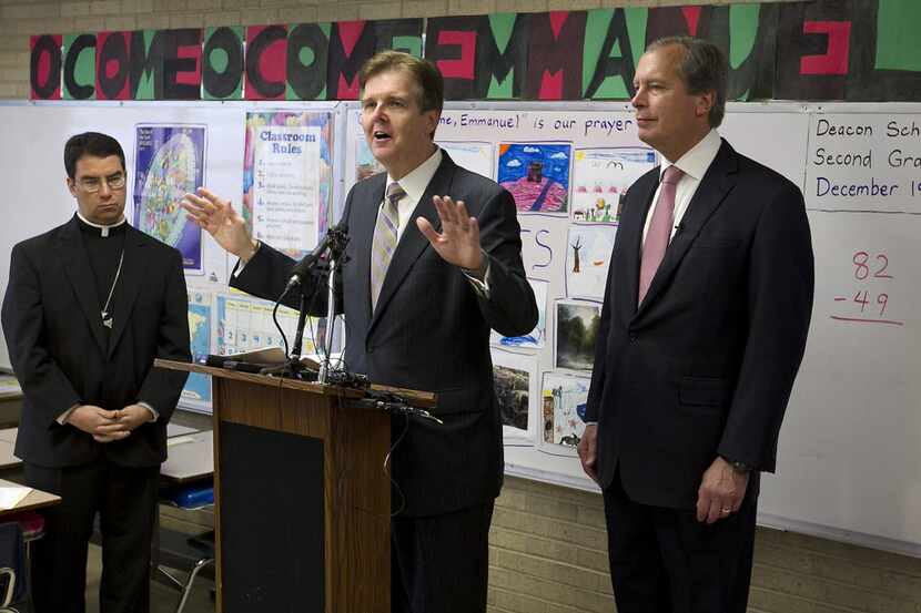 Lieutenant governor candidate Dan Patrick, center, spoke as his GOP runoff opponent,...