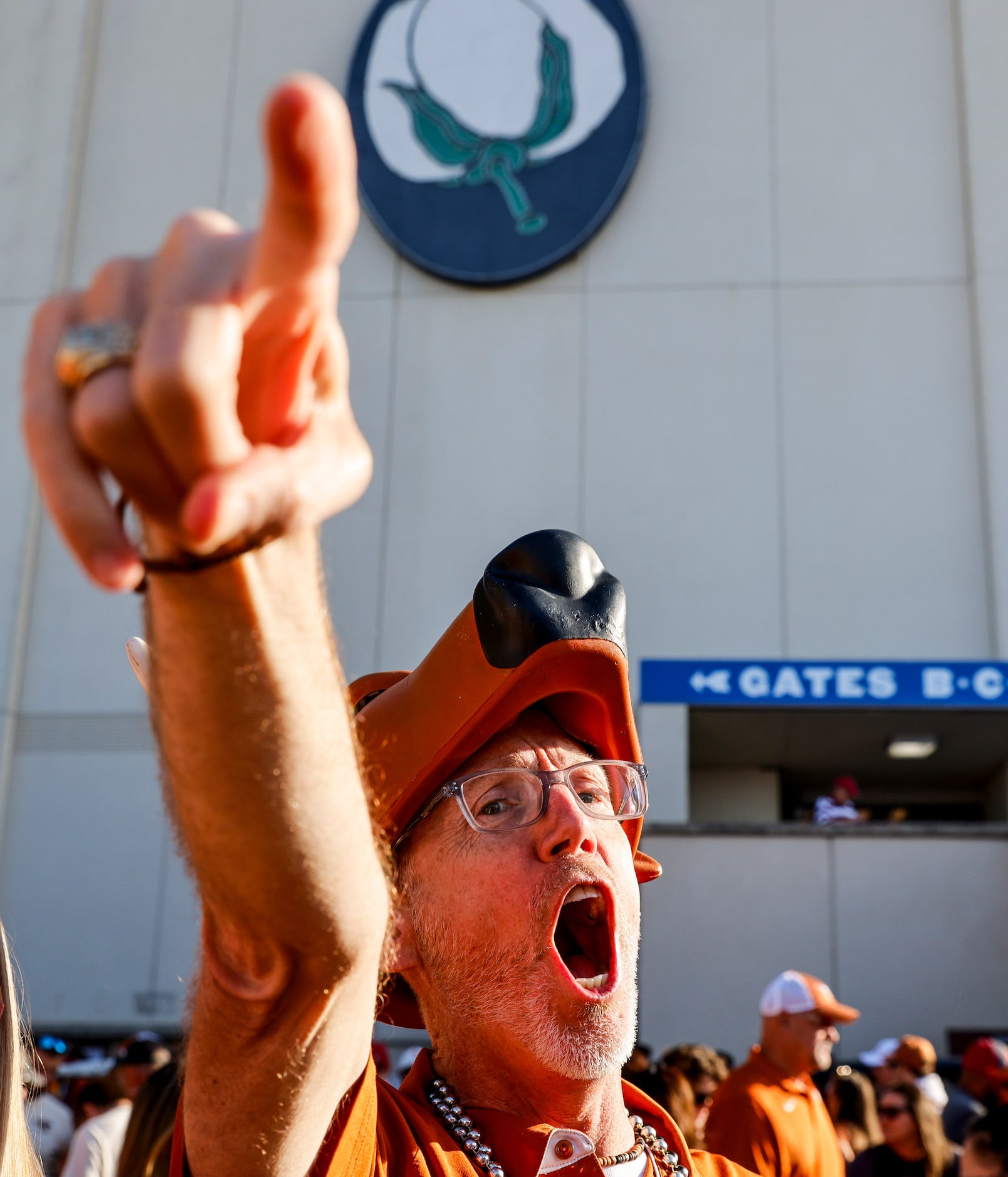 Chris Stewart from Austin cheers ahead of the Red River Showdown at the Cotton Bowl, on...