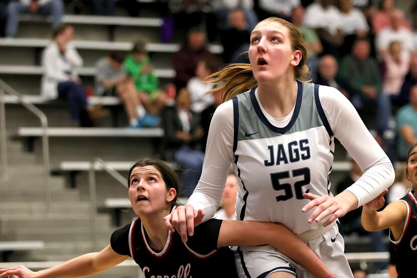 Flower Mound center Abbie Boutilier (52) looks to rebound against Coppell during the first...