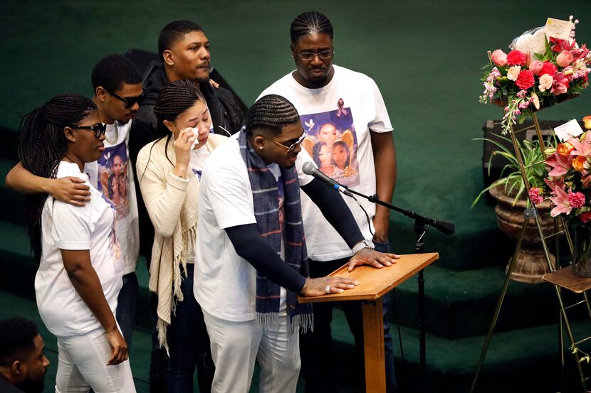 Brothers and sisters of LaTiffiney Rodgers, clockwise from Ramone Compton at microphone,...