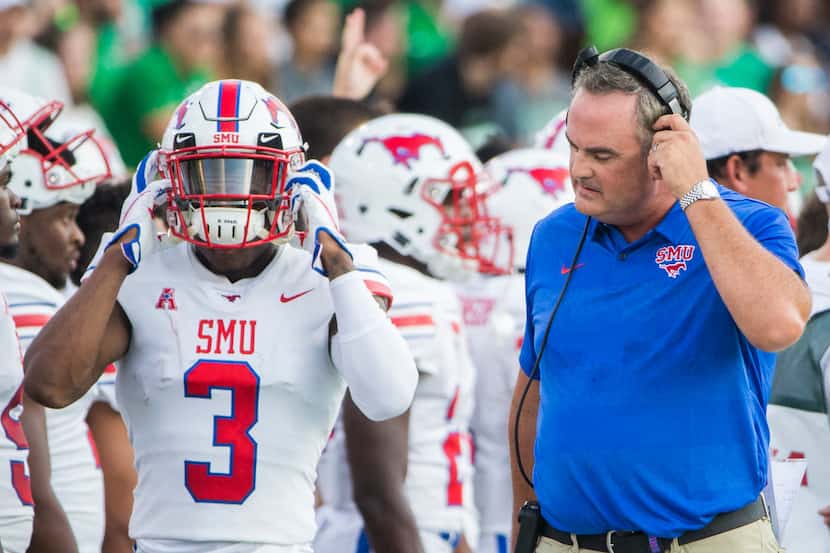 Southern Methodist Mustangs head coach Sonny Dykes reacts to a play on the sideline during a...