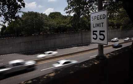 A speed limit sign says 55 mph on southbound Dallas North Tollway between Faifax Avenue and...