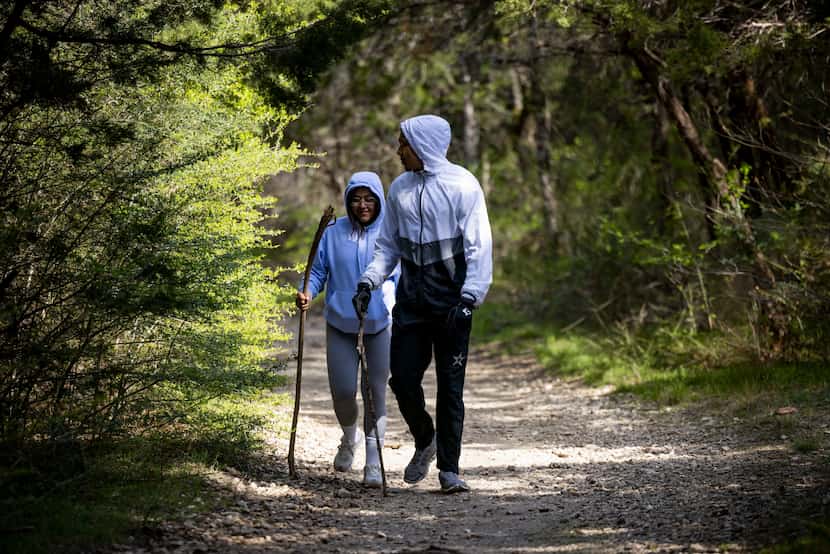 John Witherspoon and Karen Garcia of Fort Worth head back to the trailhead after finishing a...