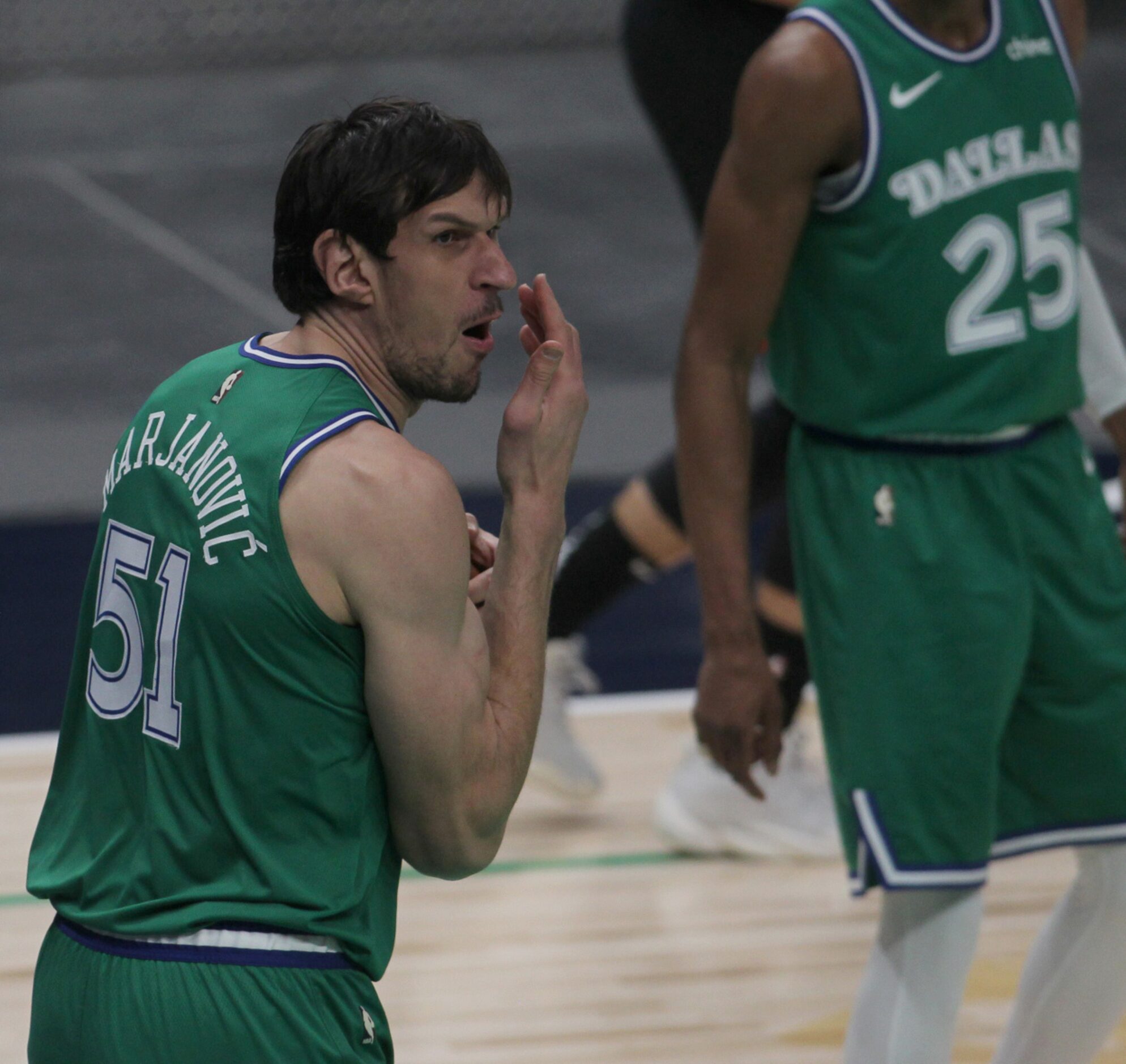 Dallas Mavericks center Boban Marjanovic (51) reacts after being called forna foul during...