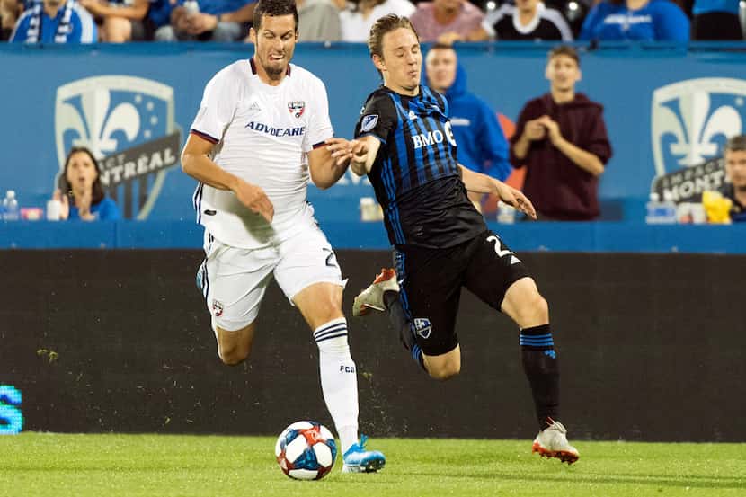 Montreal Impact's Lassi Lappalainen, right, challenges FC Dallas' Matt Hedges during...