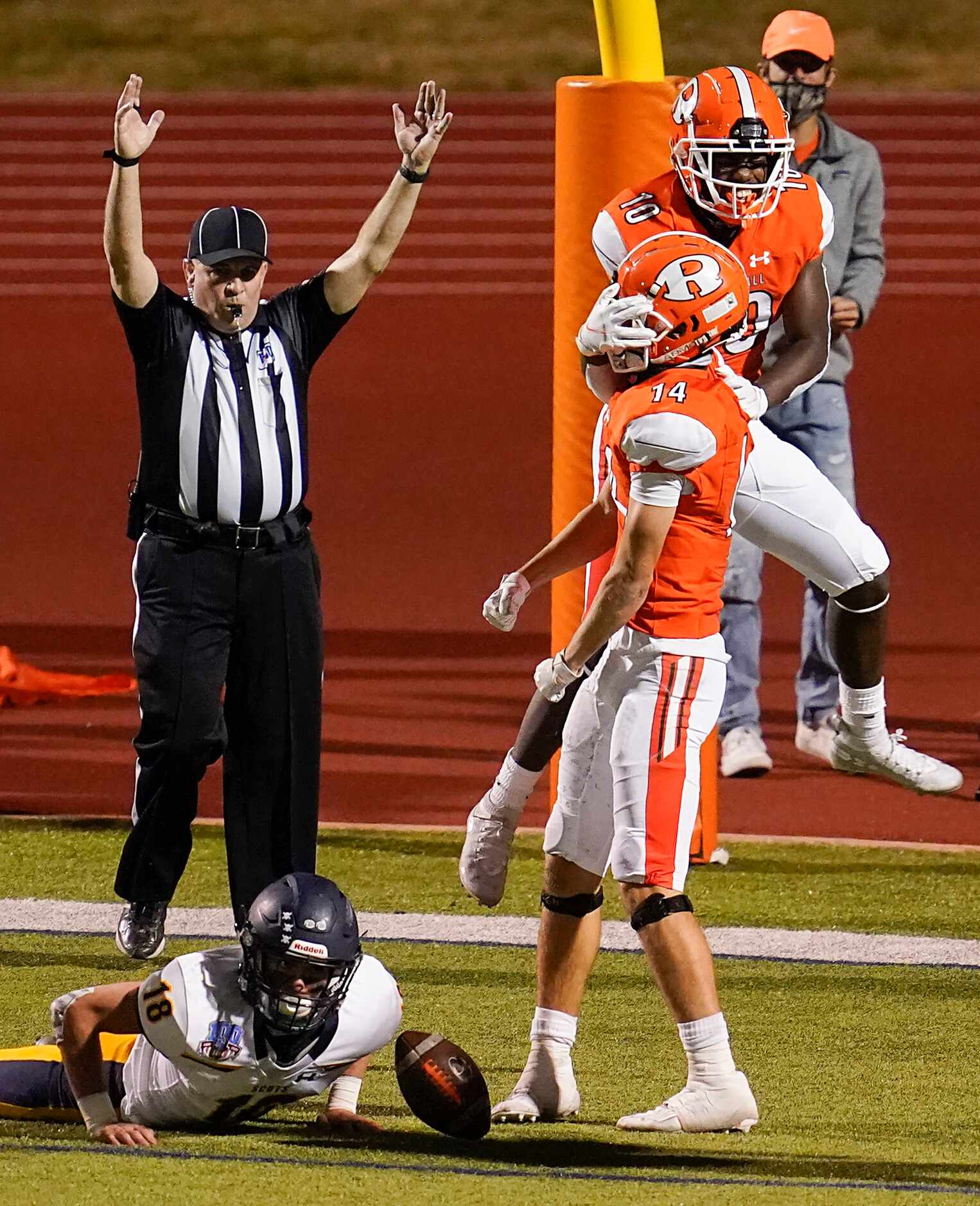 Rockwall wide receiver Caden Marshall (14) celebrates a touchdown pass with Goodnews...