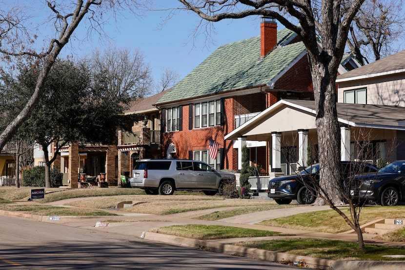 A mix of single-family houses and duplexes line the King's Highway neighborhood in north Oak...