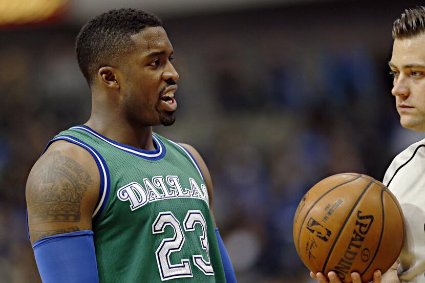 Dallas Mavericks guard Wesley Matthews (left) argues a call with an official during the...