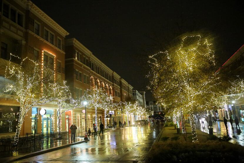 Lights illuminate the area during Christmas in the Square in downtown Frisco on Dec. 16,...