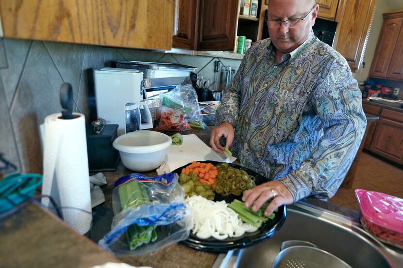 Ricky Kleibrink prepares a relish dish for an event at his home in Decatur, Texas on October...