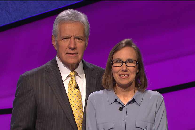 Melissa Hodges, standing with "Jeopardy!" host Alex Trebek, is part-time mechanical...