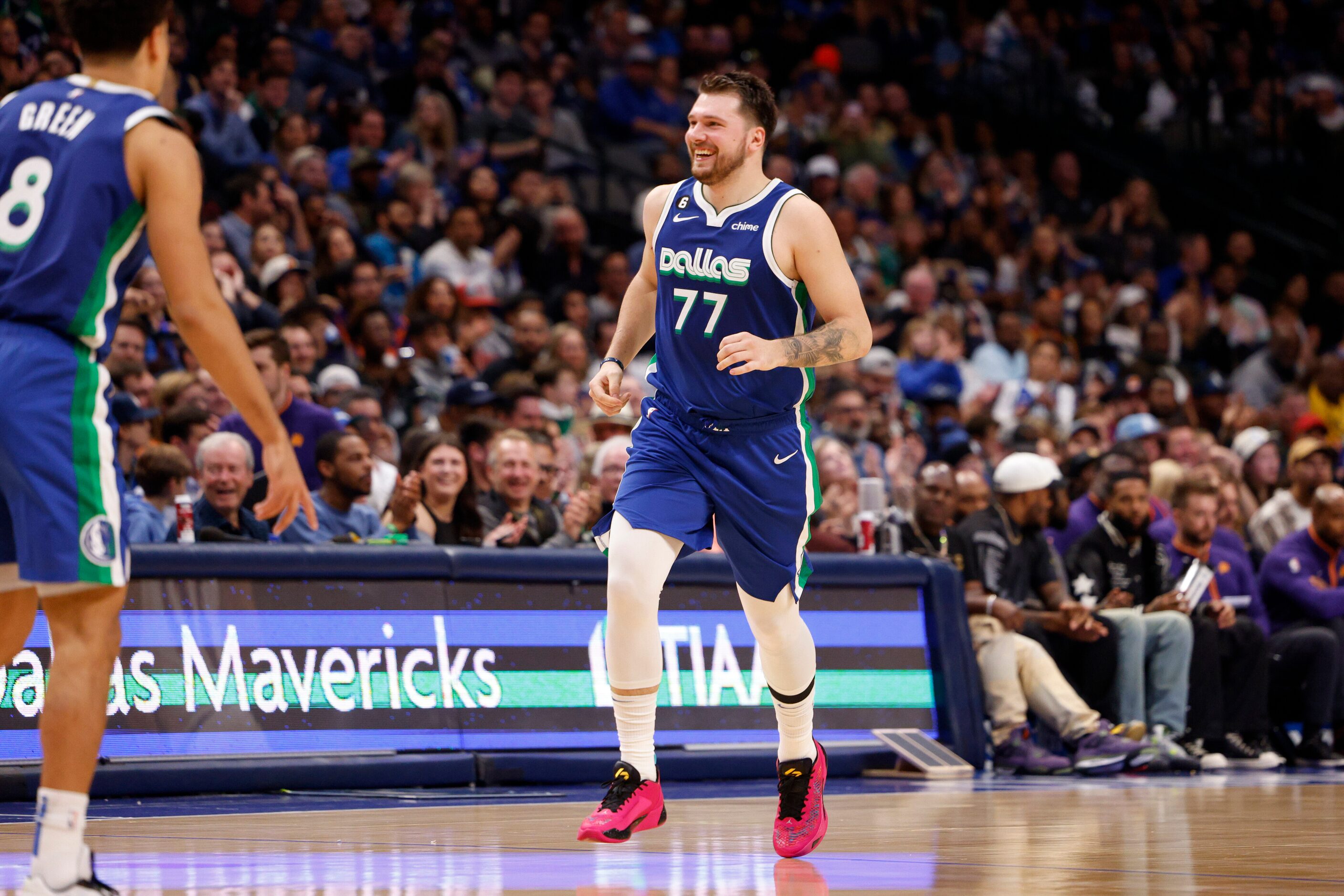 Dallas Mavericks center Dwight Powell (7) smiles after making a basket during the first half...