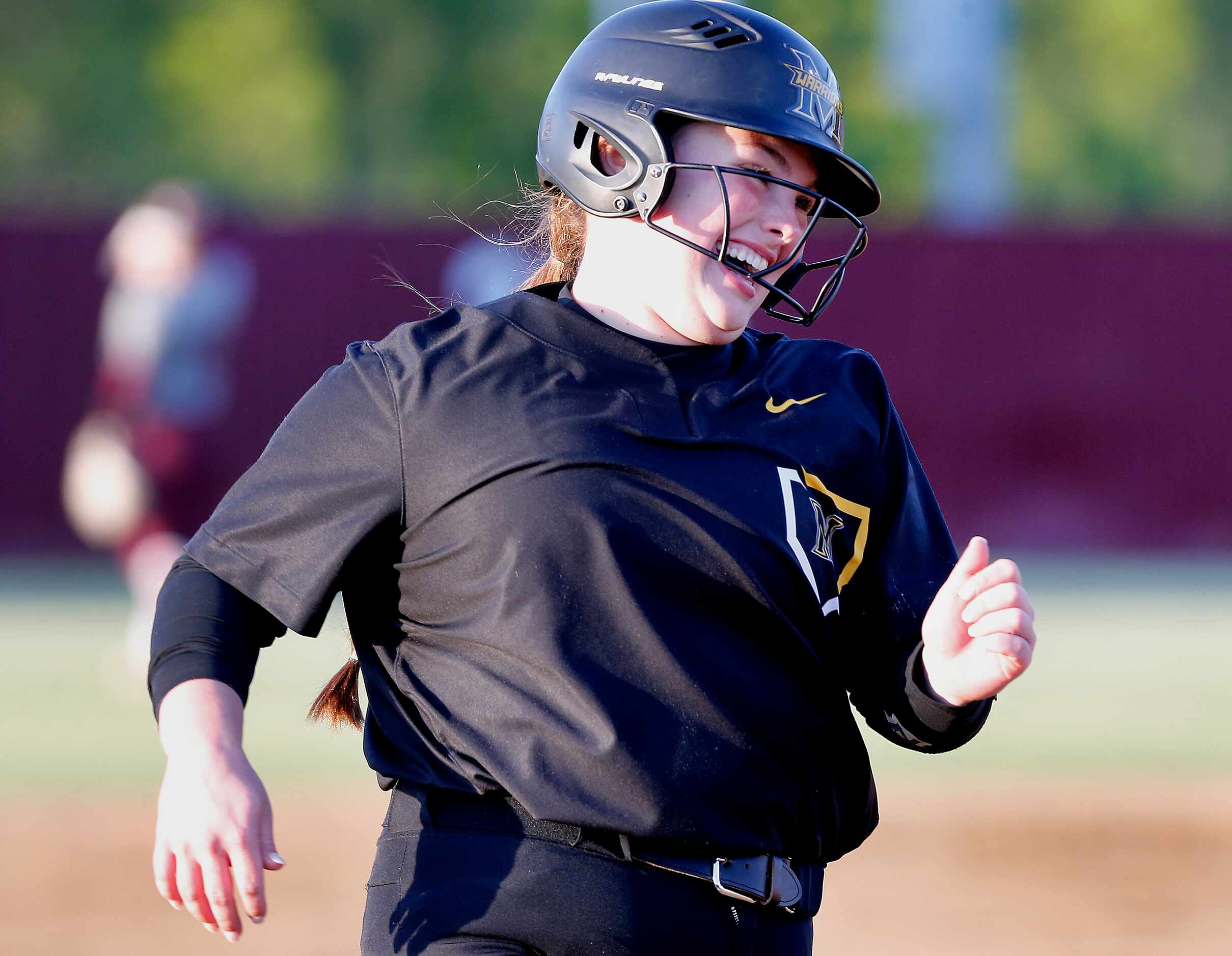 Memorial’s first baseman Peyton Chianese (27) was all smiles as she rounded third base and...