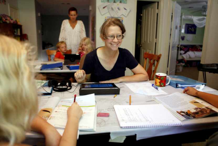 Christa Downer teaches Hayden O'Donnell-Downer, 8, left, and Danijela Perge, 8, at home. “I...