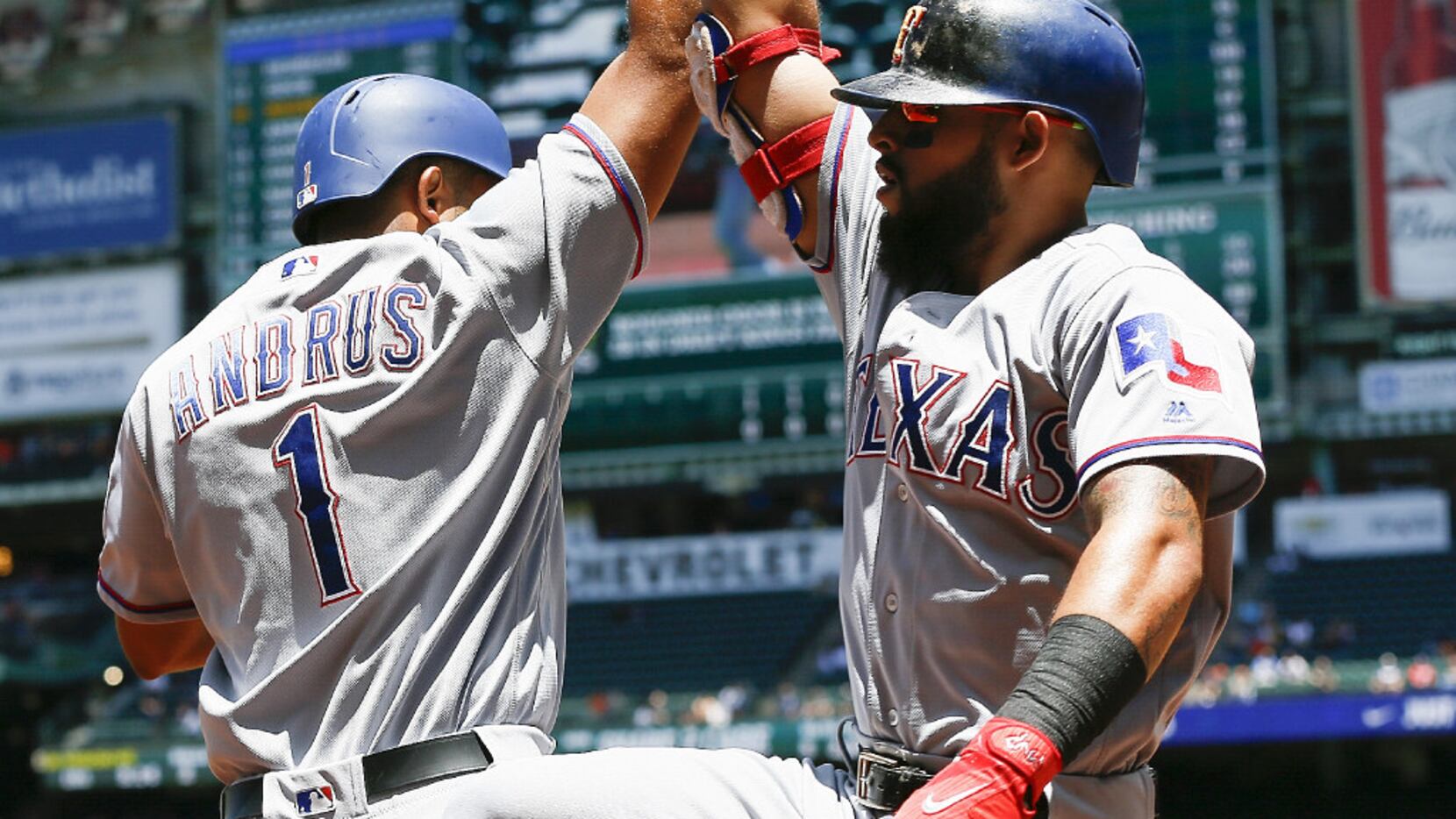 HOUSTON, TX - MAY 04:  Rougned Odor #12 of the Texas Rangers receives a high five from Elvis...