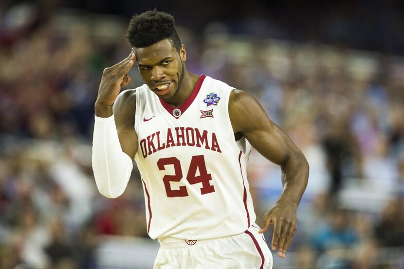 Oklahoma guard Buddy Hield reacts after making a shot during the first half of a 2016 NCAA...