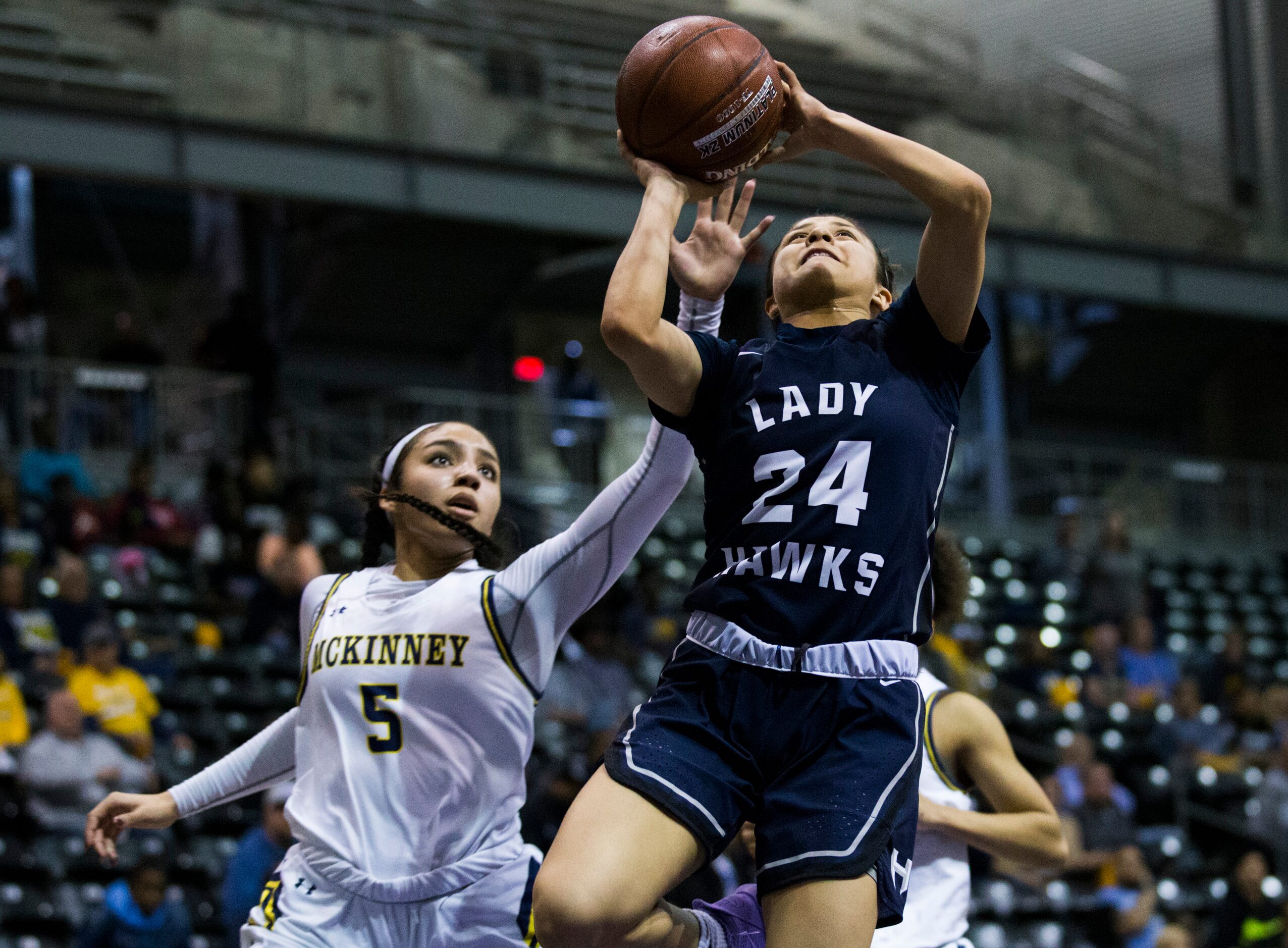 McKinney guard Trinity White (5) defends against Pflugerville Hendrickson guard Erika Suarez...