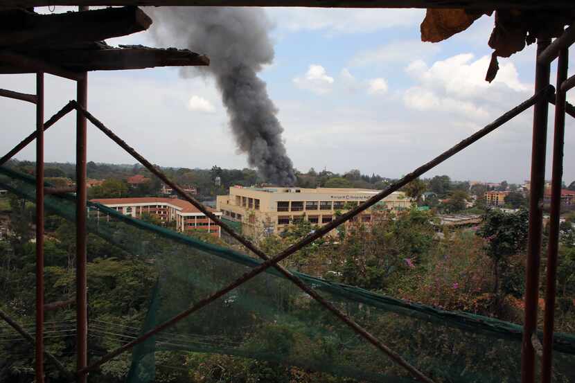 Heavy smoke rises from the Westgate Mall in Nairobi Kenya Monday Sept. 23 2013. Multiple...