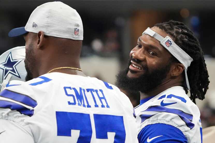 Dallas Cowboys offensive tackle Ty Nsekhe (79) talks with offensive tackle Tyron Smith (77)...