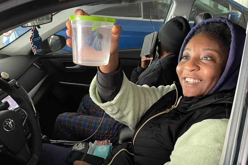 Ebun Oyo admires her pet fish, an unnamed blue betta on Tuesday, February 16, 2021 in...