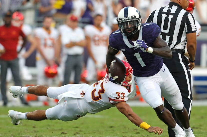 TCU wide receiver Jalen Reagor (1) escapes the tackle of Iowa State defensive back Braxton...