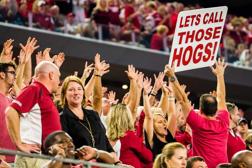 Arkansas Razorbacks fans cheer during the fourth quarter of their game on Saturday,...