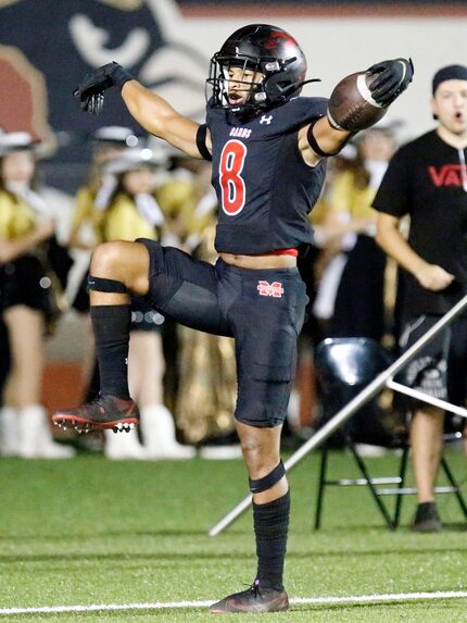 Melissa High School running back Jacob Fields (8) celebrates a touchdown run during the...