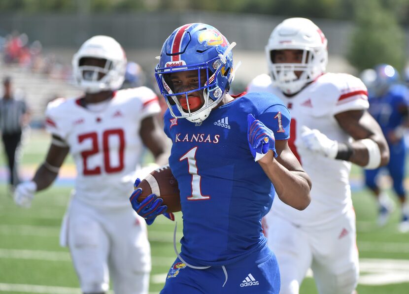 Running back Pooka Williams Jr. #1 of the Kansas Jayhawks runs for 52-yard touchdown...