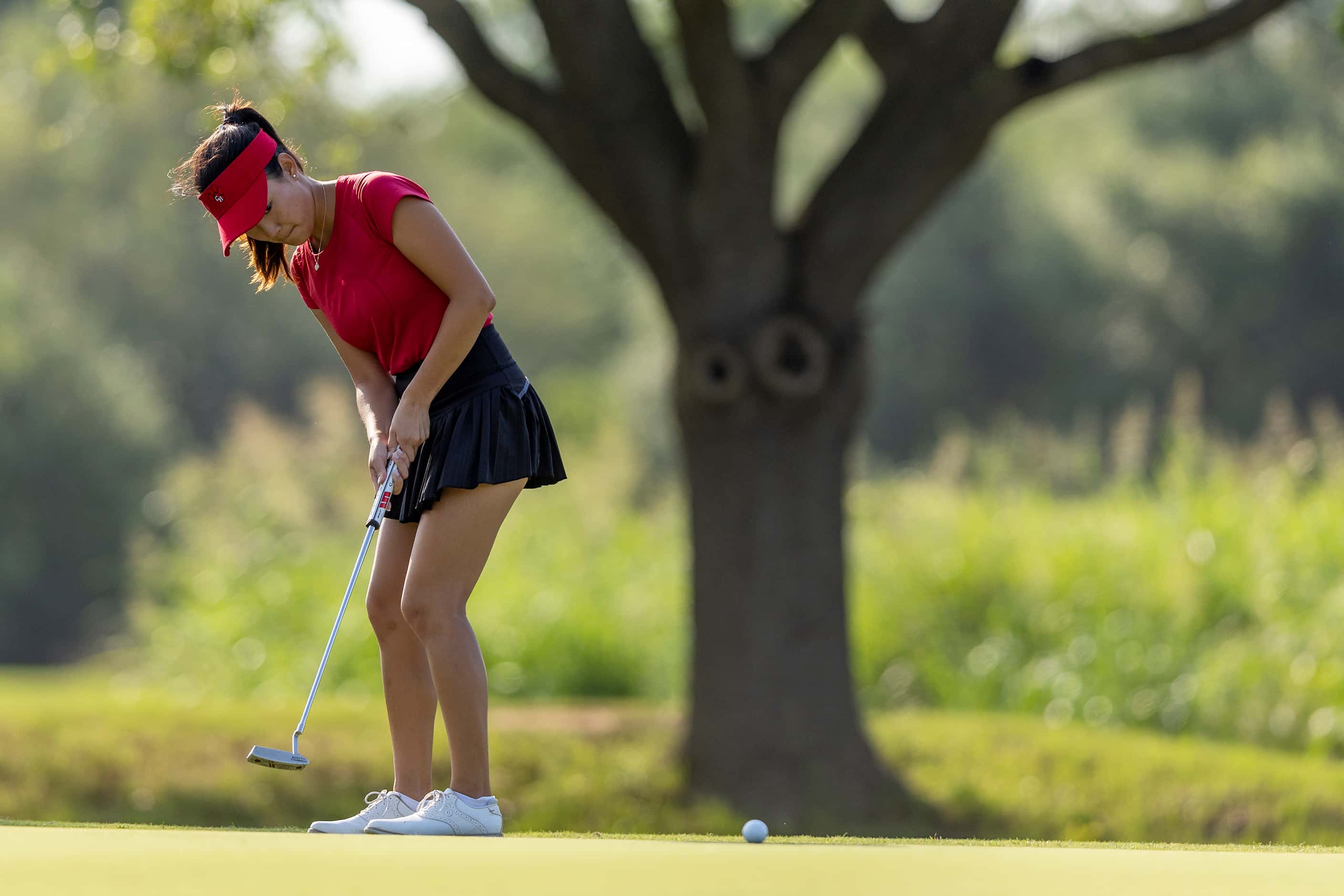 Colleyville Heritage Cindey Xiao putts on the 3rd green during the 5A girls state golf...
