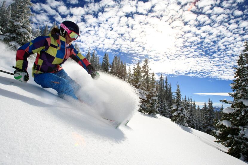 A skier makes her way downhill at Blue Sky Basin in Vail, Colo. The ski destination was...