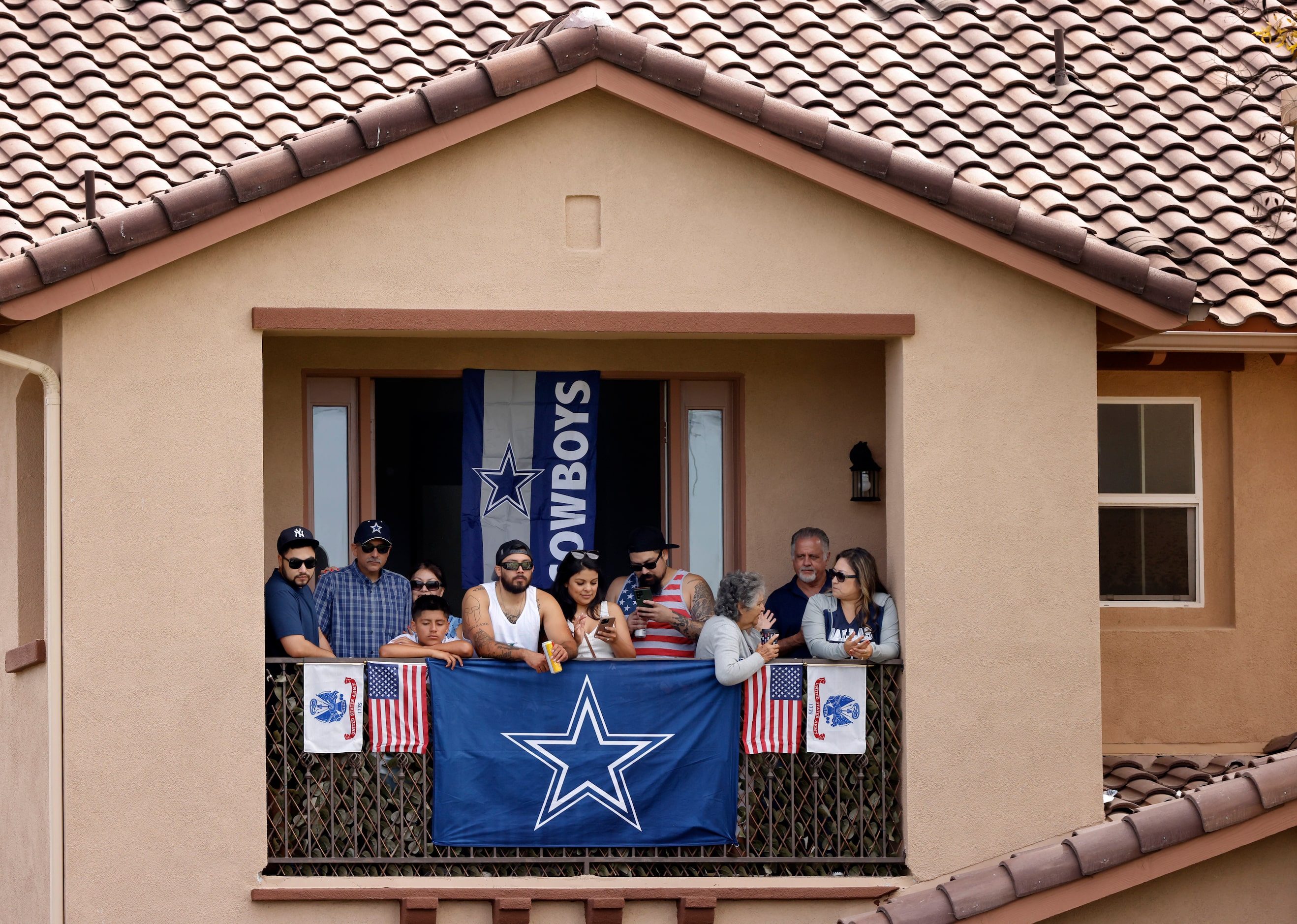 The Acosta family watched the Dallas Cowboys training camp practice from their Oxnard,...