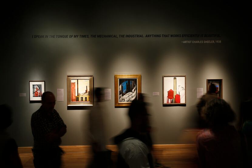People walk in front of selected pieces of art during a soft opening of Cult of the Machine:...