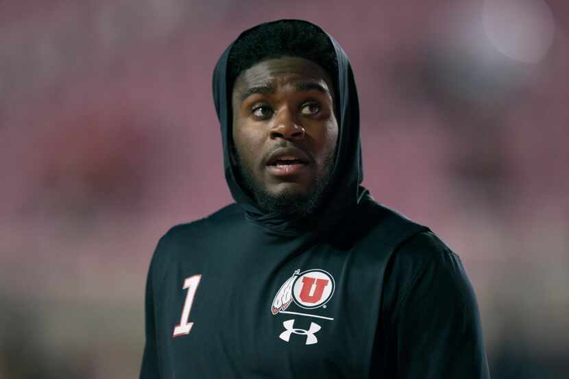 File - Utah corner Jaylon Johnson warms up before a game against Cal at Rice-Eccles Stadium...