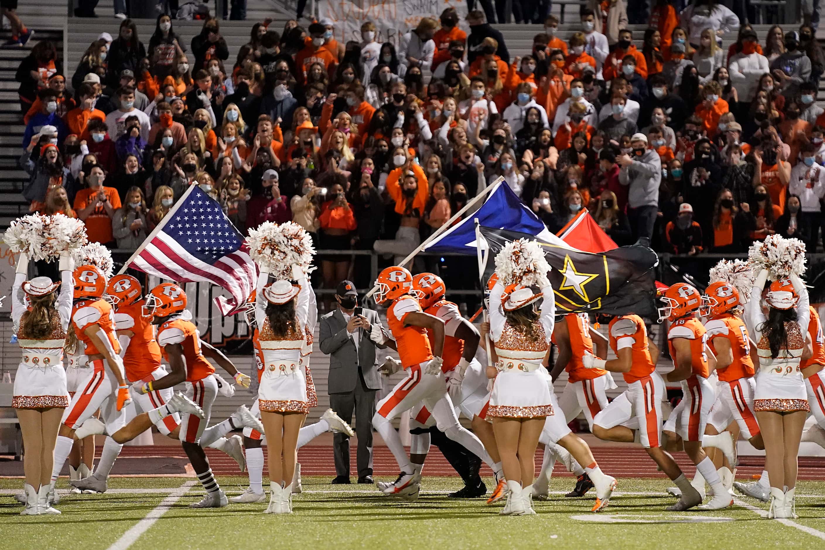 Rockwall players take the field before a high school football game against Highland Park on...