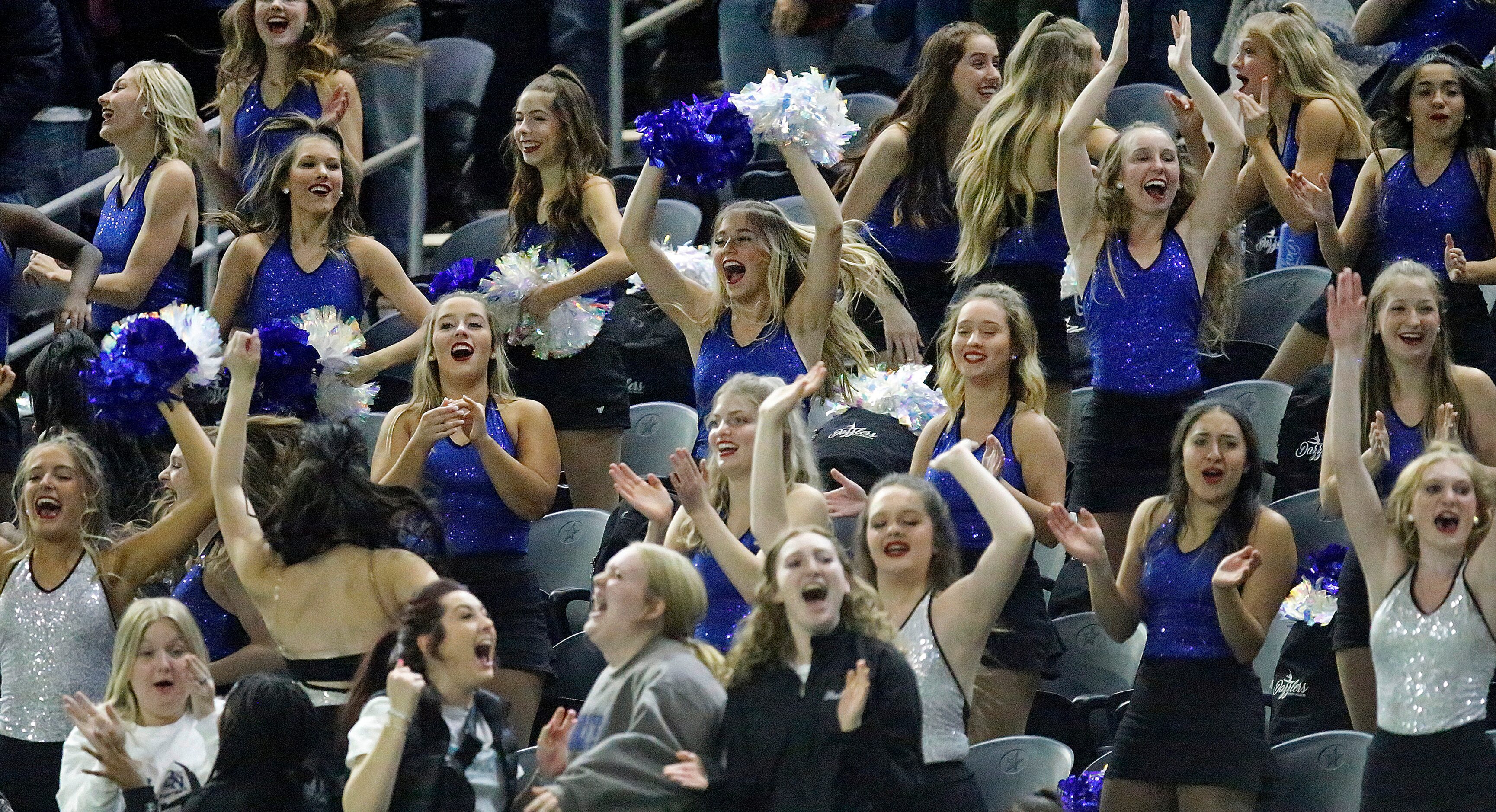 The Byron Nelson High School drill team celebrates a touchdown catch during the first half...