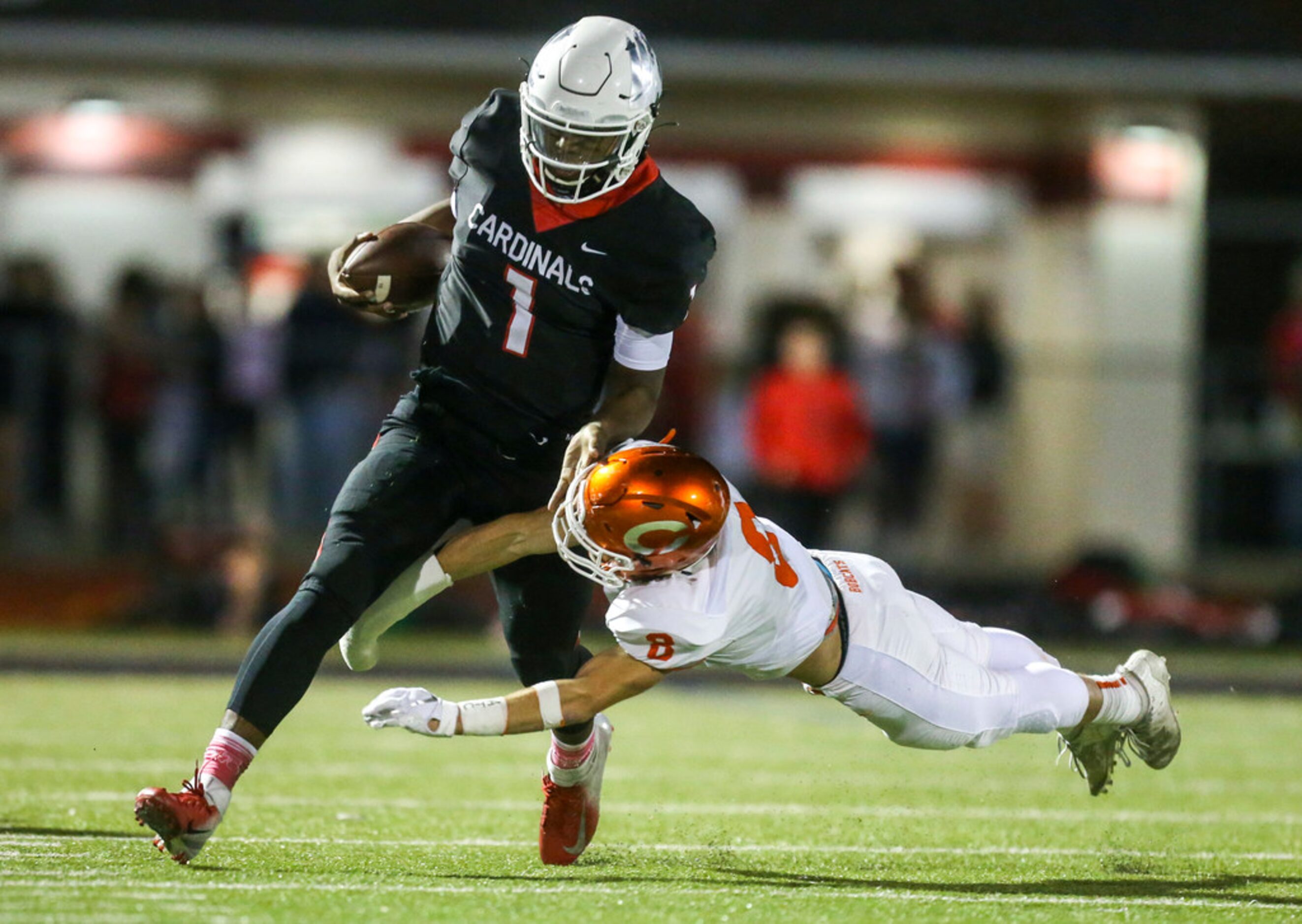 Melissa quarterback Brendon Lewsi (1) carries the ball past Celina defensive back Cason...