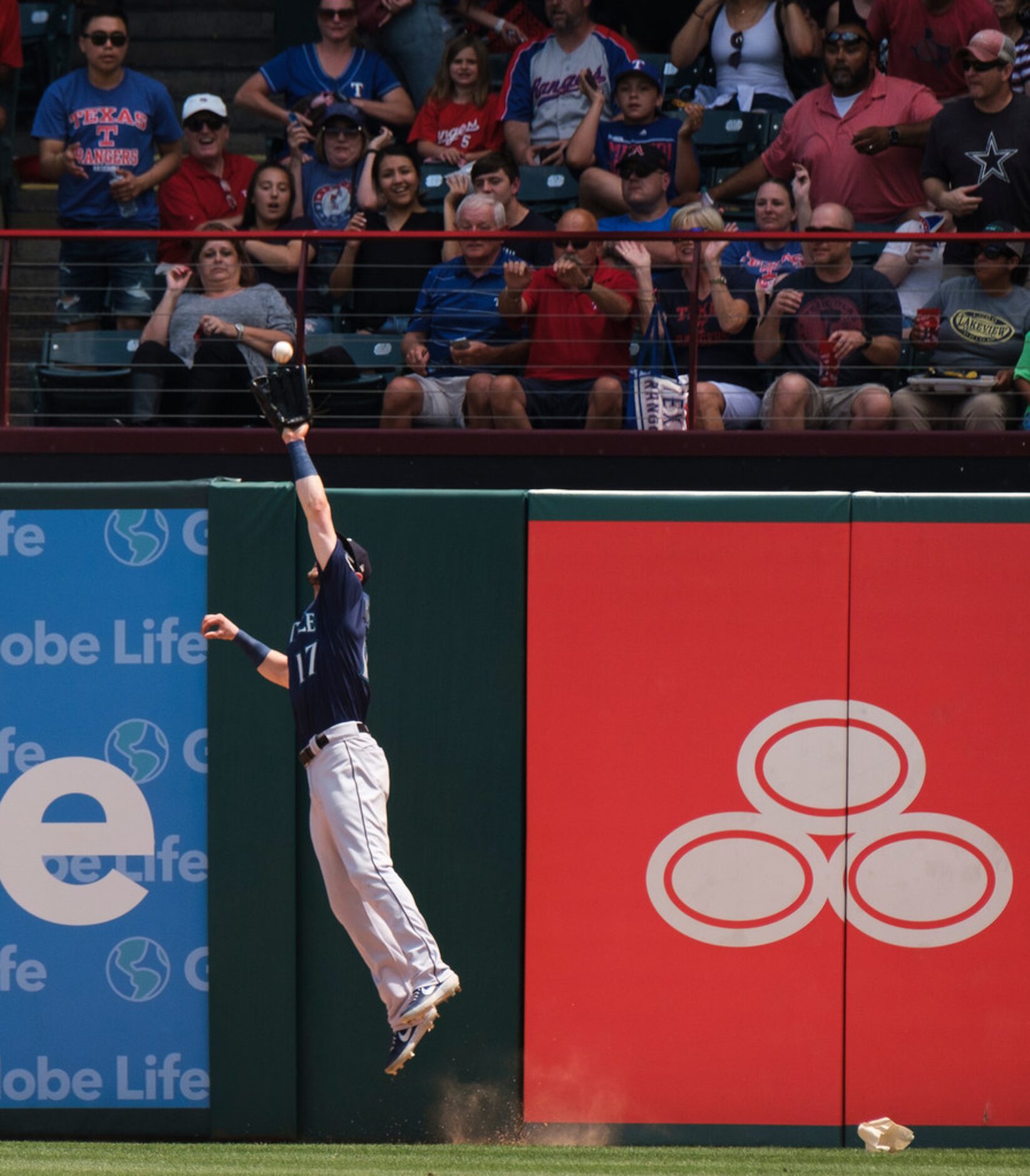 Seattle Mariners right fielder Mitch Haniger makes a leaping catch at the wall on a ball hit...