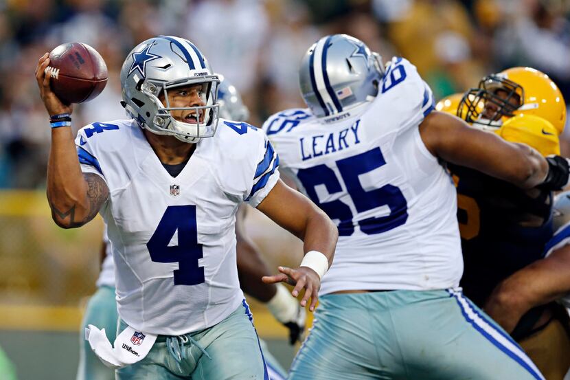 Dallas Cowboys quarterback Dak Prescott (4) looks to pass under pressure during the second...