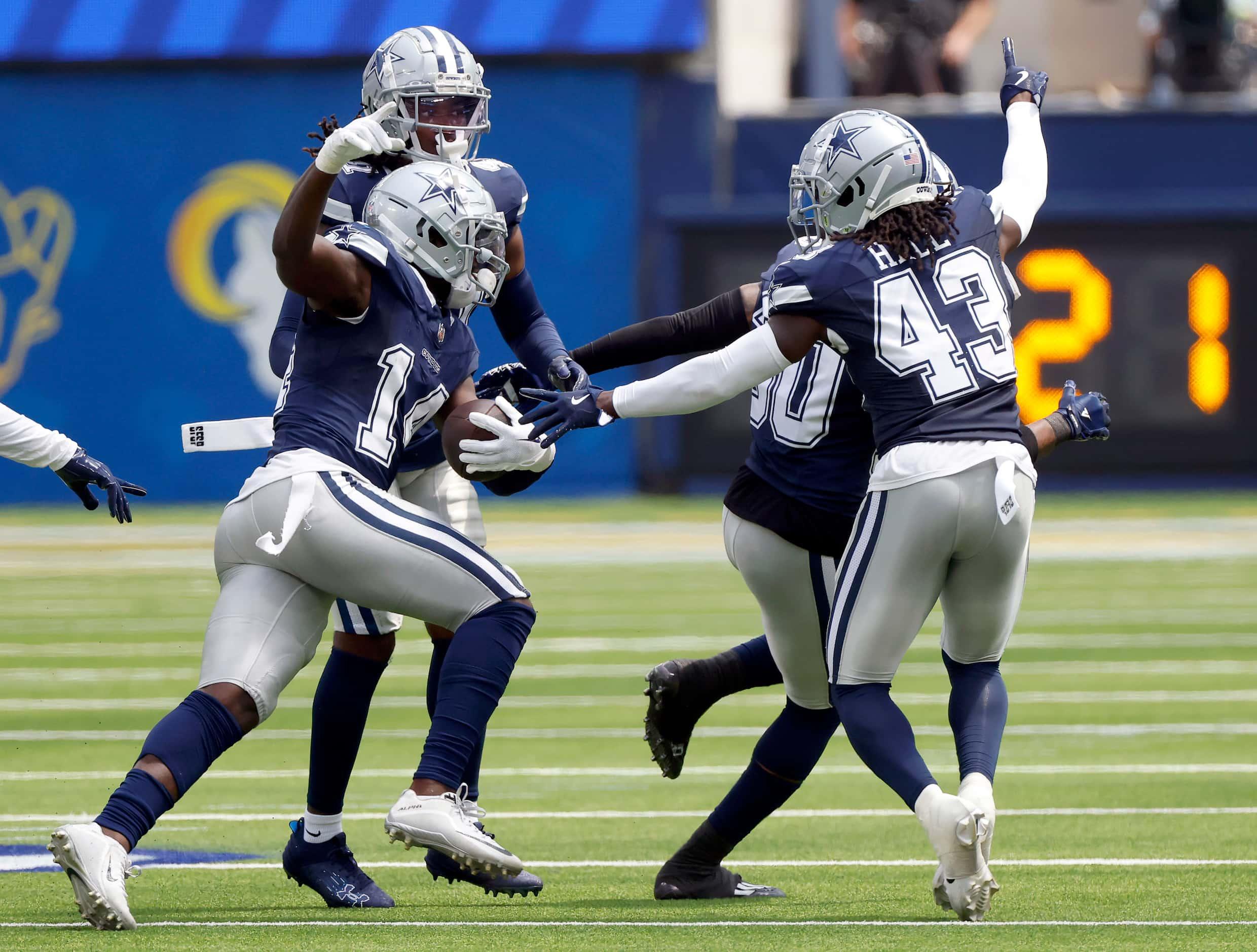 Dallas Cowboys safety Markquese Bell (14, left) celebrates his first quarter interception...