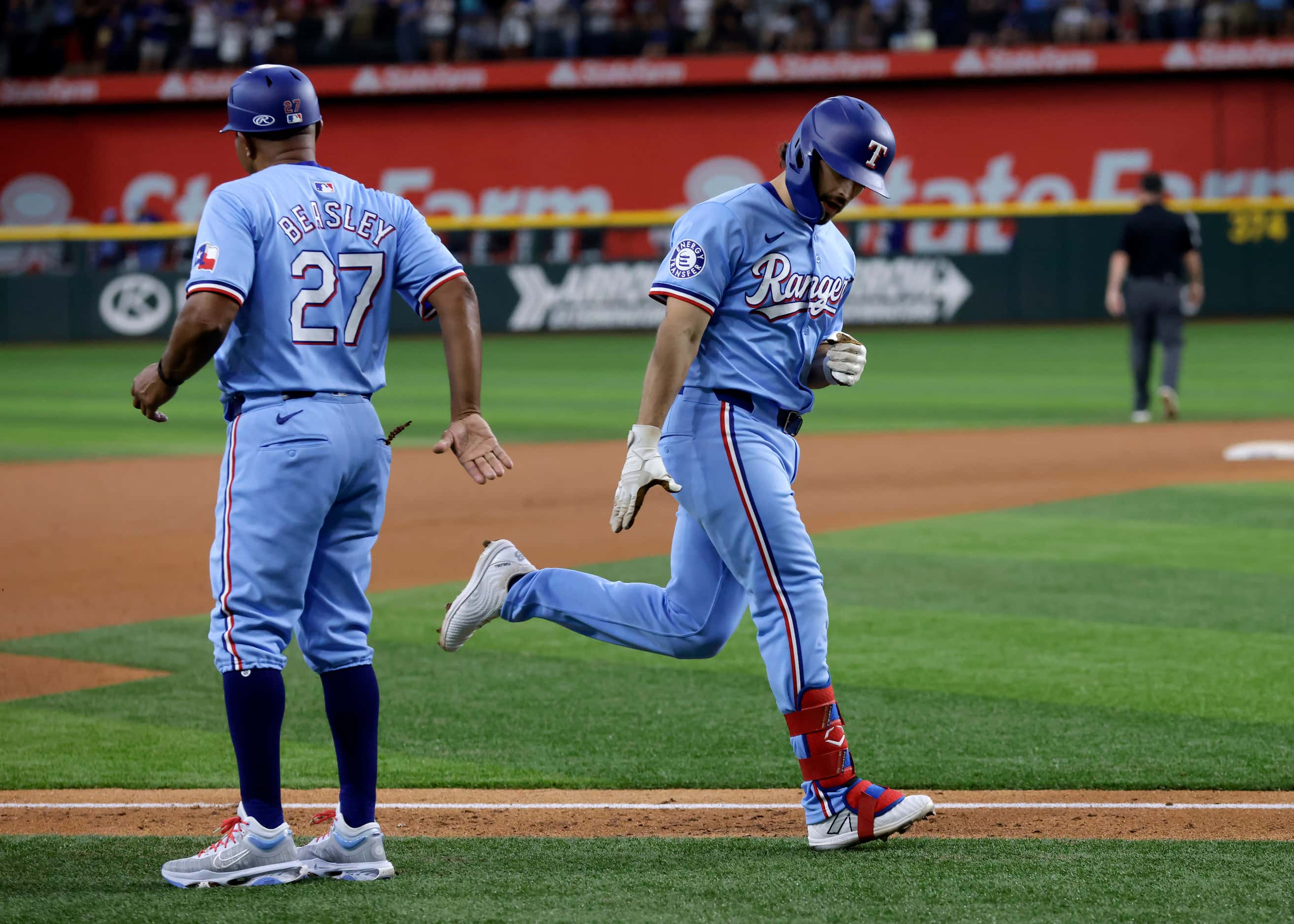 Texas Rangers Josh Smith (left) is congratulated on his solo home run against the Kansas...