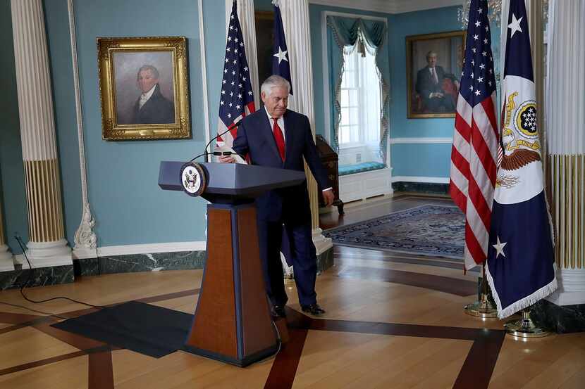 Secretary of State Rex Tillerson departs after answering questions and delivering a...
