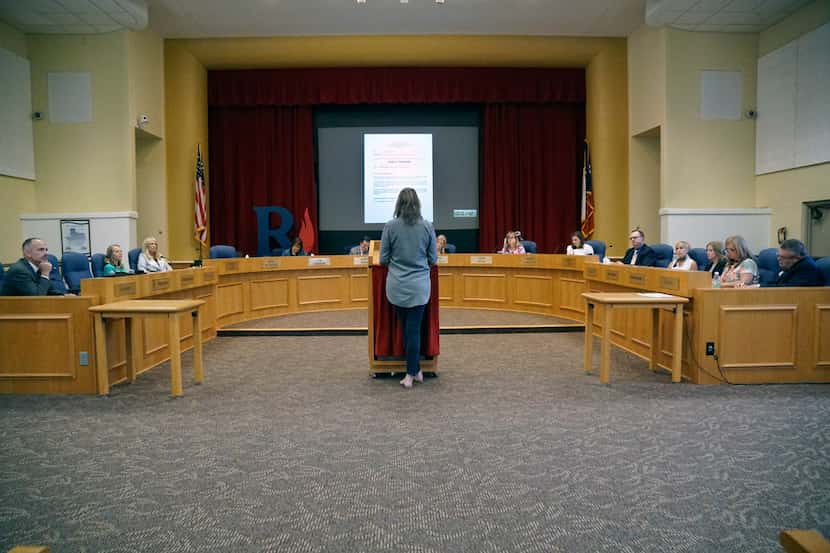 Richardson ISD school board members listen to a speaker during a meeting at the...