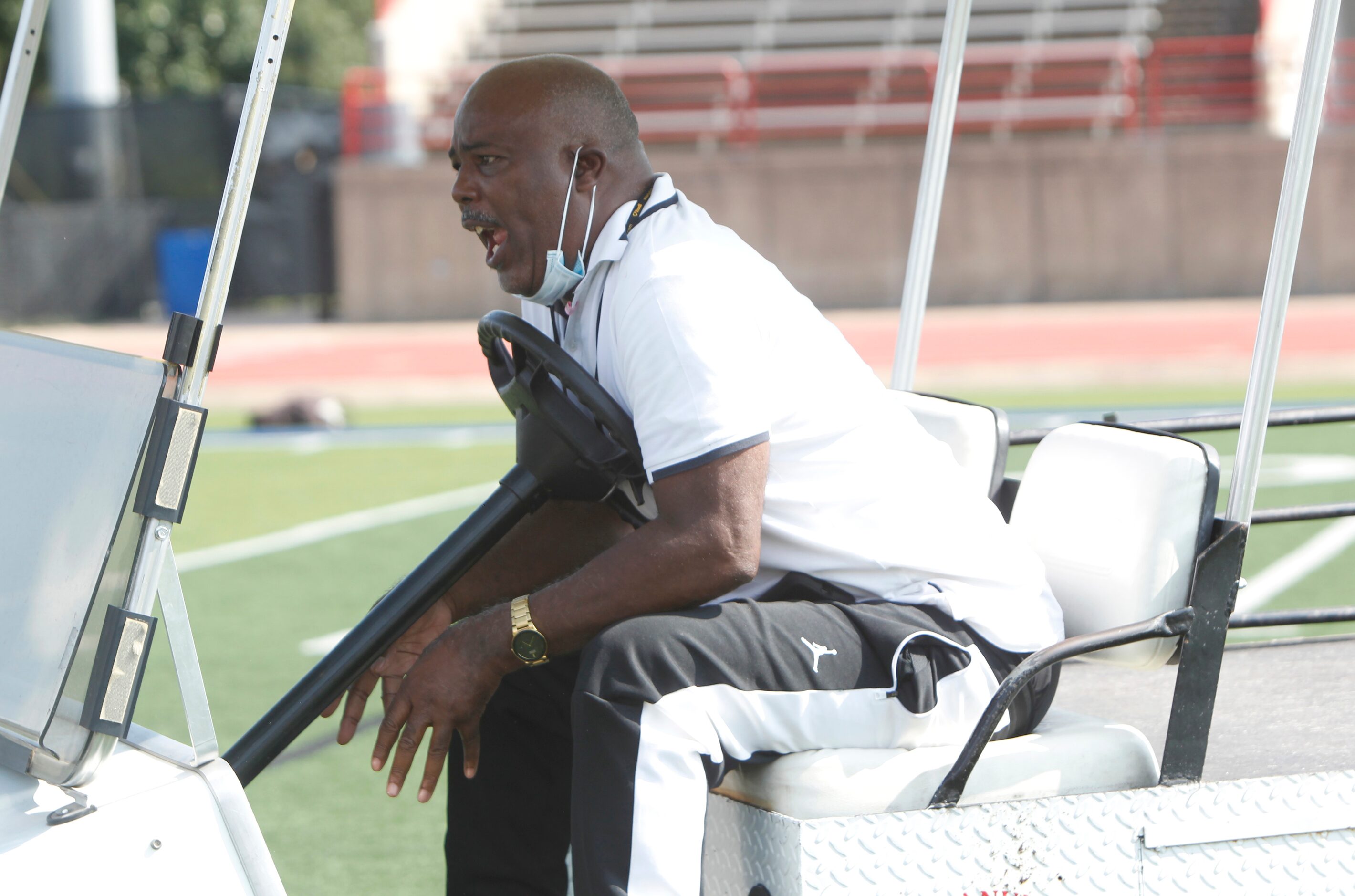 Duncanville Panthers head coach Reginald Samples communicates with his players during a...