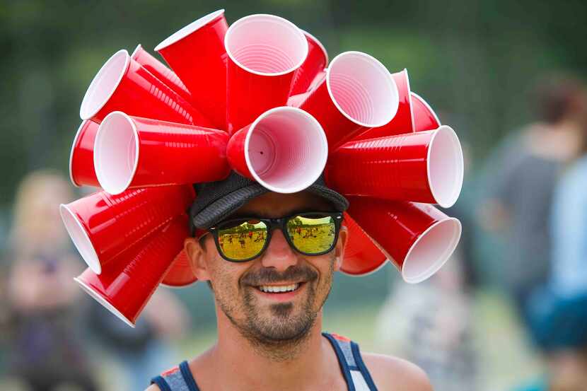 Brandon Orff, of Crumpton, Md., wears a cup hat during the third day of Firefly Music...